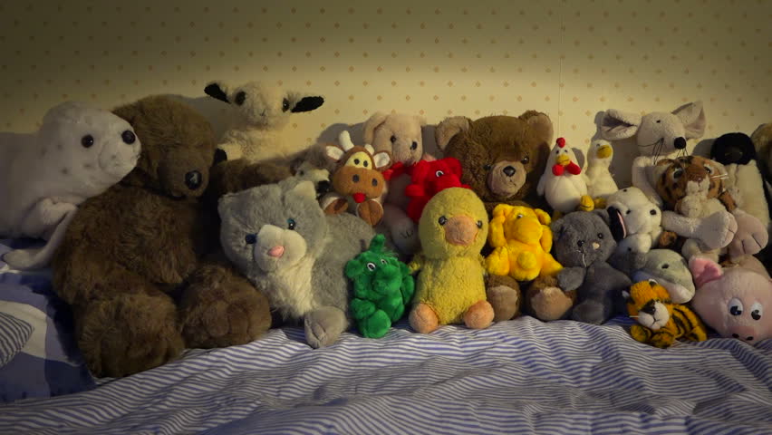 stuffed animals on bed