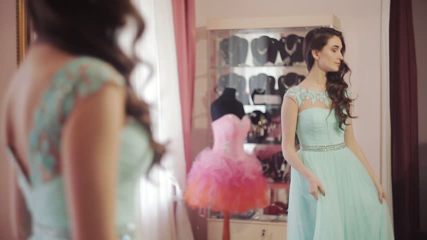Beauty Teenage Girl In Red Dress Applying Make Up And Admiring Herself In The Mirror Beautiful