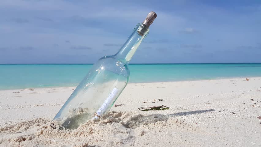 SLOW MOTION: Stranded Bottle On The Beach Stock Footage Video 5978108