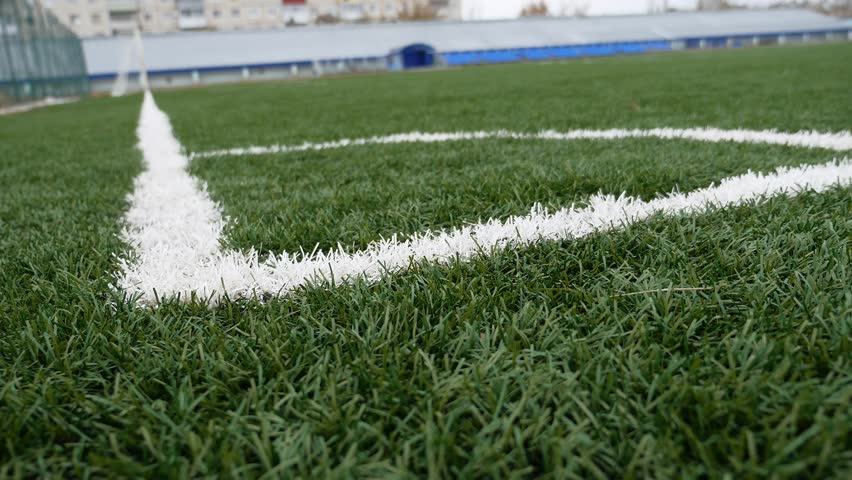 Rack Focus To An End Zone Pylon On A Football Field. Stock Footage