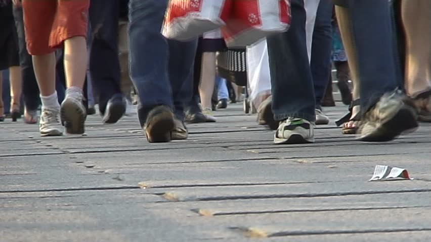 View Of People's Feet Walking On Busy Street Stock Footage