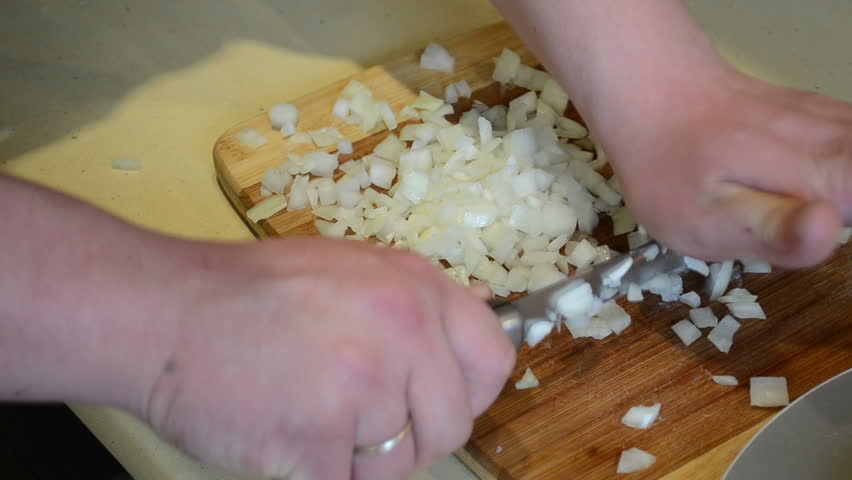 hands-cut-onion-with-knife-on-table-board-into-small-pieces-healthy