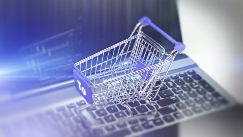 Online Shopping. Shopping Cart On A Keyboard. Background Video Of