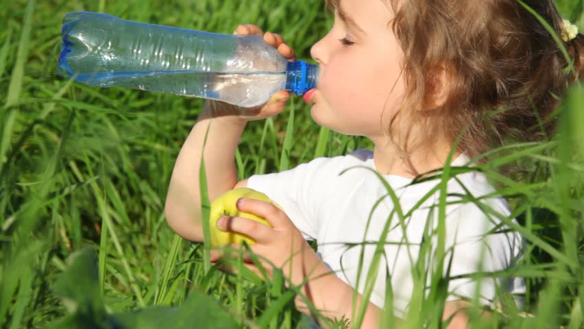 Girl Drinking Water From Bottle And Eating Apple Stock Footage Video