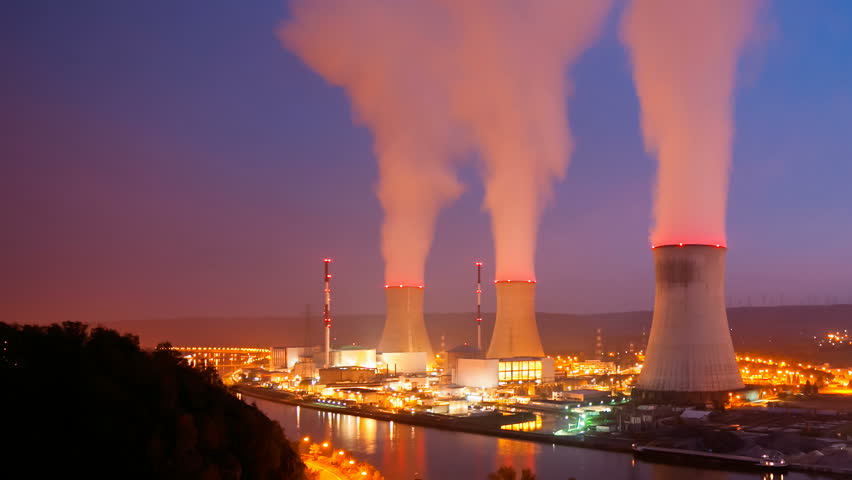 Time Lapse Sequence Of A Large Nuclear Power Station At Night Stock
