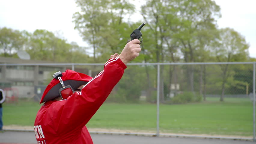 Man Firing Starter Pistol At Track Meet In Slow-motion Stock Footage Video 7302439 - Shutterstock