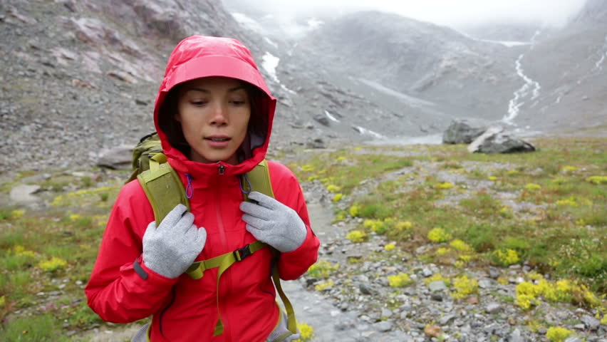 Trekking Woman Hiking On Hike With Backpack In Rain Living ...