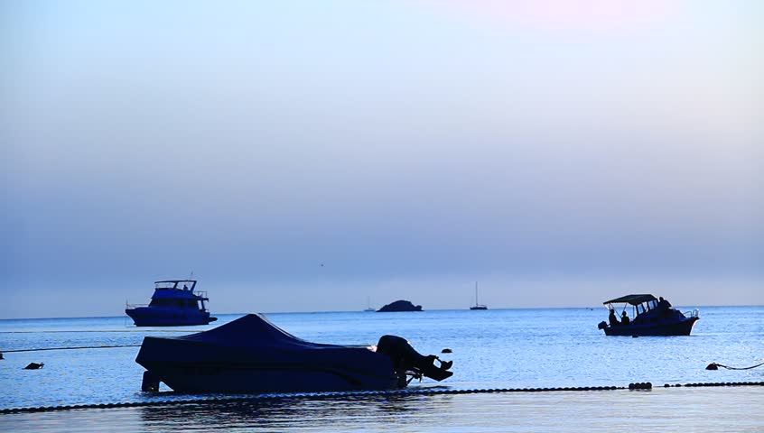  on calm sea with boats and small sailing boats. - HD stock video clip