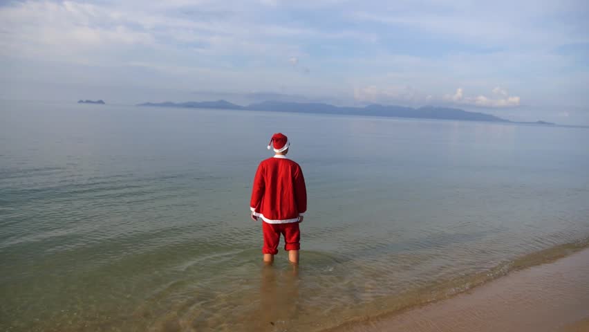 Santa Claus Relaxing On The Beach. Christmas Or Happy New Year Concept 