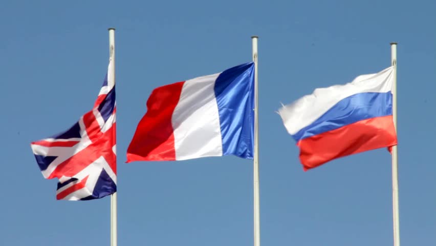 Flags Of Great Britain, France, Russia On Blue Sky Background Stock