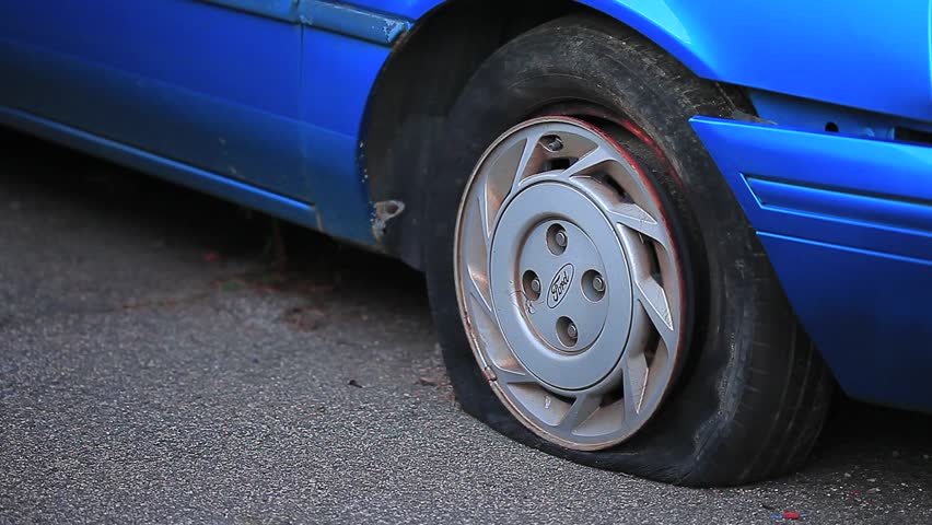 Flat Tire On Blue Car Stock Footage Video 949258 - Shutterstock