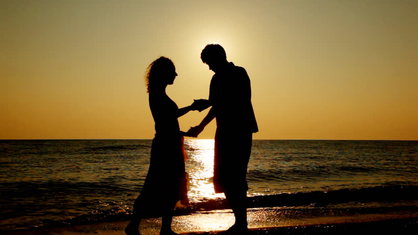 Romantic Man And Woman Talking And Having Fun On The Seaside ...