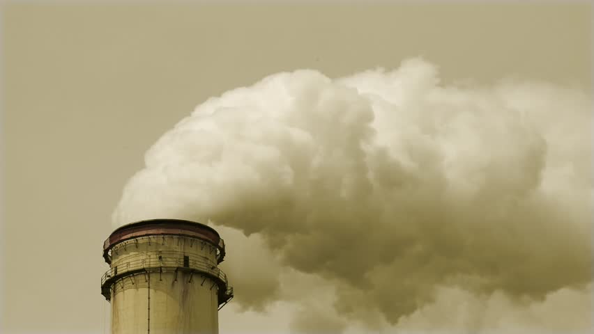 A Plume Of Steam Rises Into A Bright Blue Sky From An Industrial ...