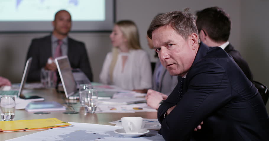 4k, Portrait Shot Of A Bored Business Man During A Boardroom Meeting ...