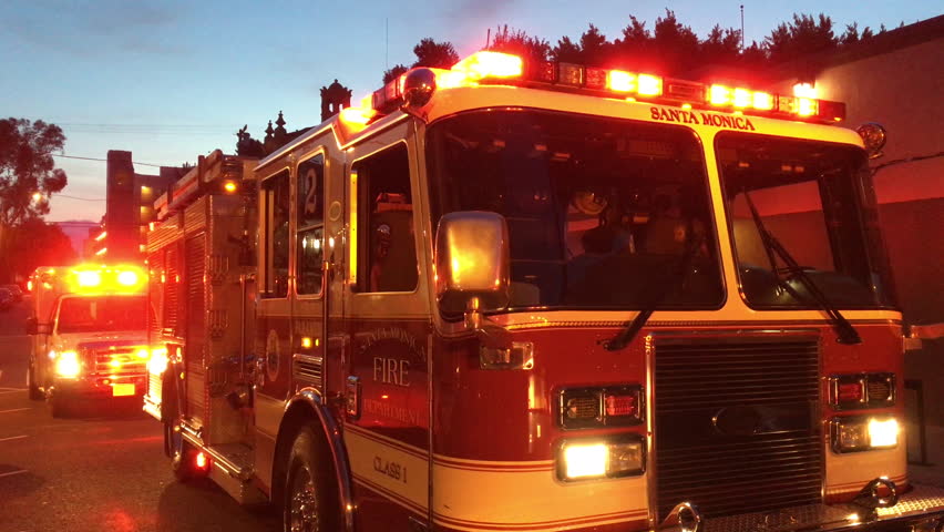 Fire Truck Responding To Disaster Idles Flashing Red Lights On Los ...