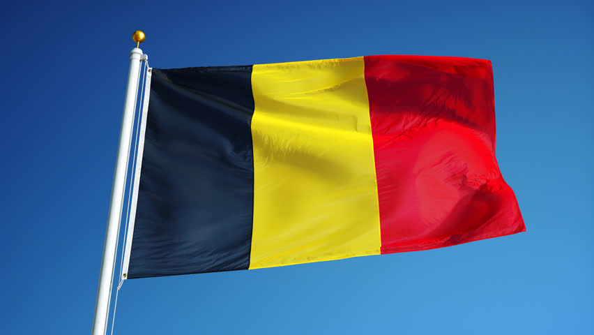Belgium National Flag Waving On Flagpole On Blue Sky Background Stock ...