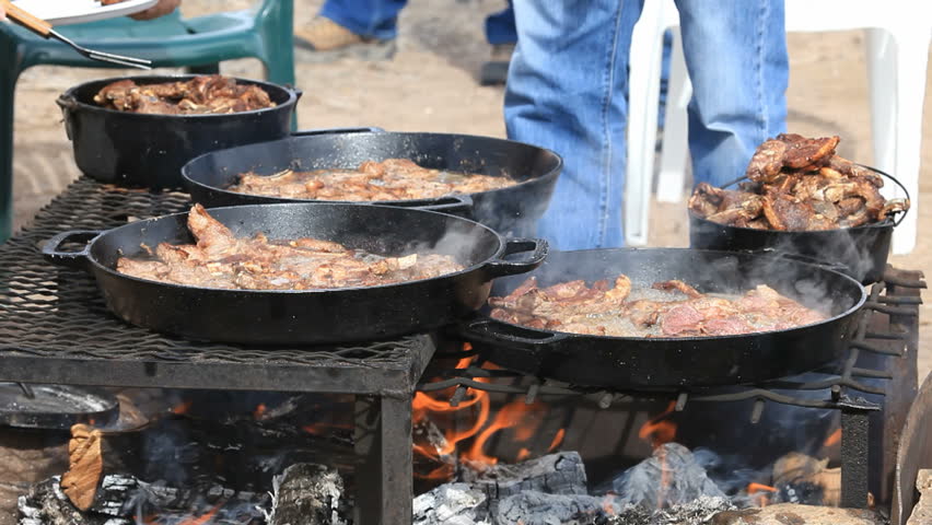 BBQ Lamb And Mutton Steaks And Chops Cooking In Cast Iron Pans Over An ...