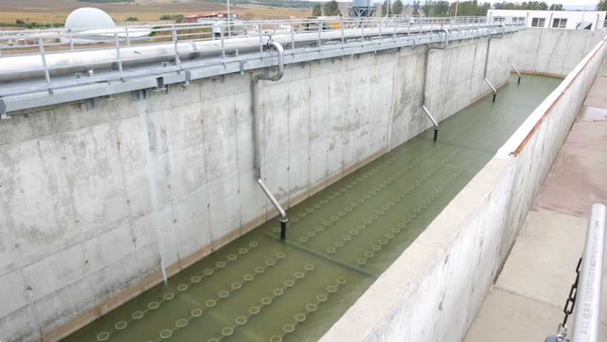 Close Up Of Wastewater Treatment Works Clarifier With Surface Skimmer ...