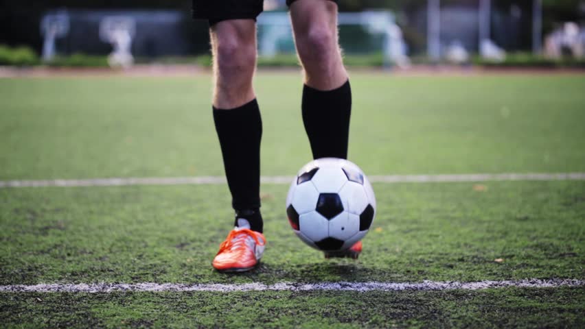 Young Soccer Player Demonstrates Footwork By Dribbling Ball Stock ...