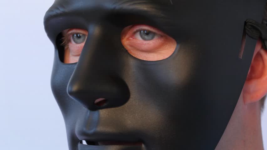 Man In Black Mask On Face Turns From Profile Full Face Close Up Stock ...