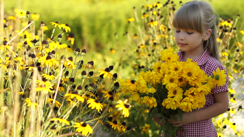 Cute African American Child Playing In A Field Of Flowers Stock Footage ...