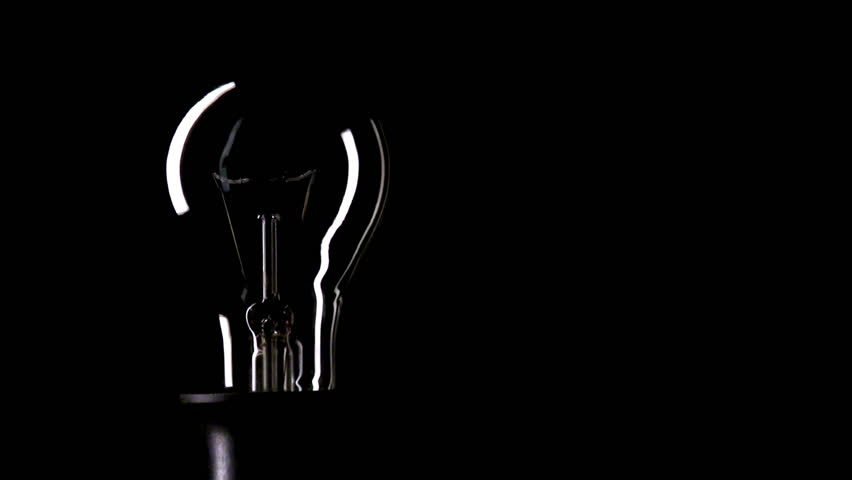 Real Light Bulb Turning On And Turning Off On Black Background, Copy ...