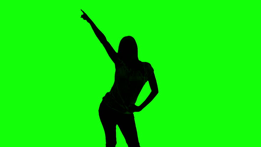 Woman's Silhouette Dancing Against A Green Screen Background Stock ...