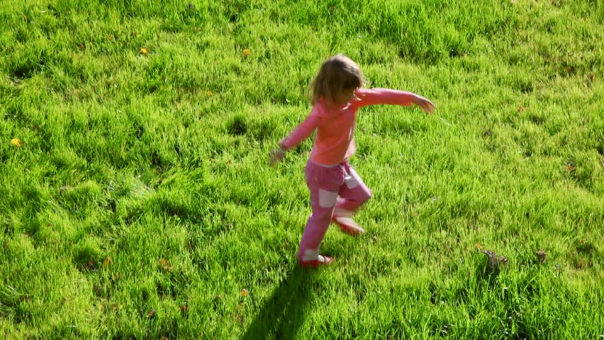 Little Girl Running Around On Green Grass Stock Footage Video 550369 ...