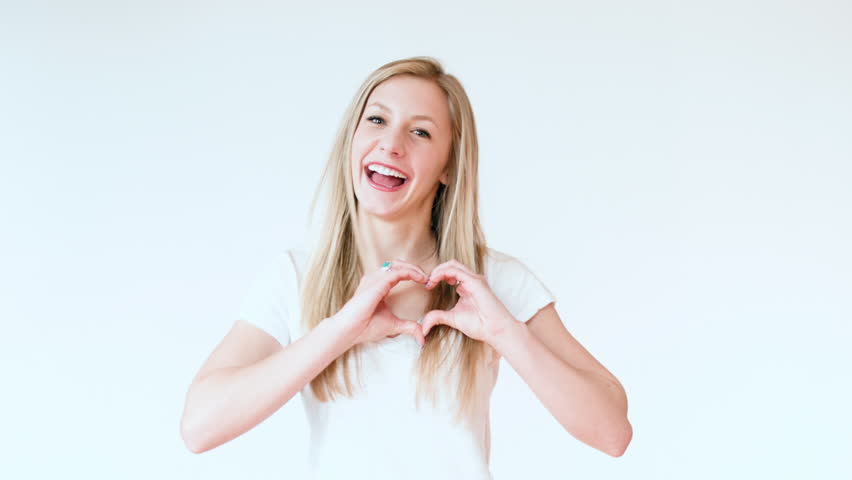 Beautiful Smiling Teen Girl Makes The Shape Of A Heart With Her Hands ...