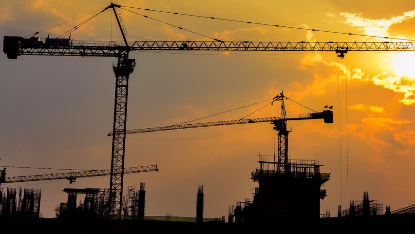 Time Lapse Sunset And Silhouette Crane Working In Construction Site ...