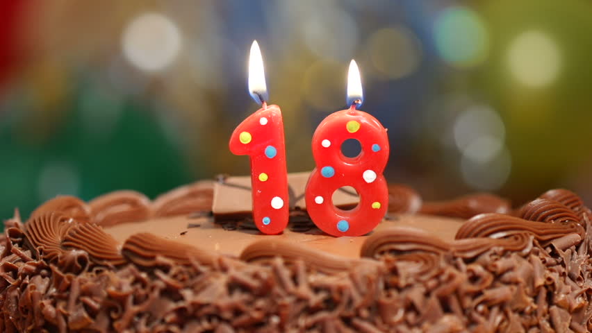 Candles On A Cake Are Blown Out For A 18th Birthday - Eighteen Years ...