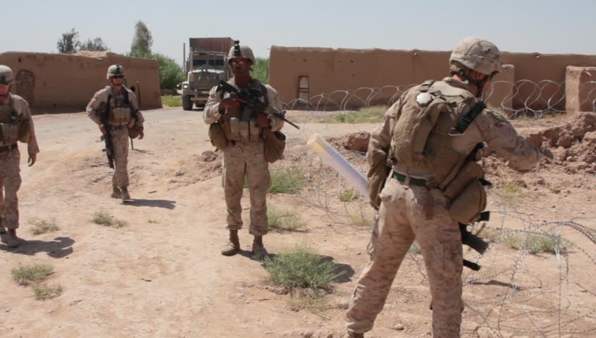 Afghanistan, Circa 2008: Marine On Patrol Stops And Shakes Hands With ...