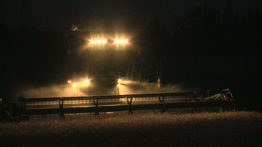 Wheat Harvesting With A Combine Harvester At Night Stock Footage Video ...