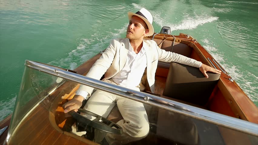 Young Man Enjoying Motorboat Ride On Lake. Luxury Holiday Happiness ...