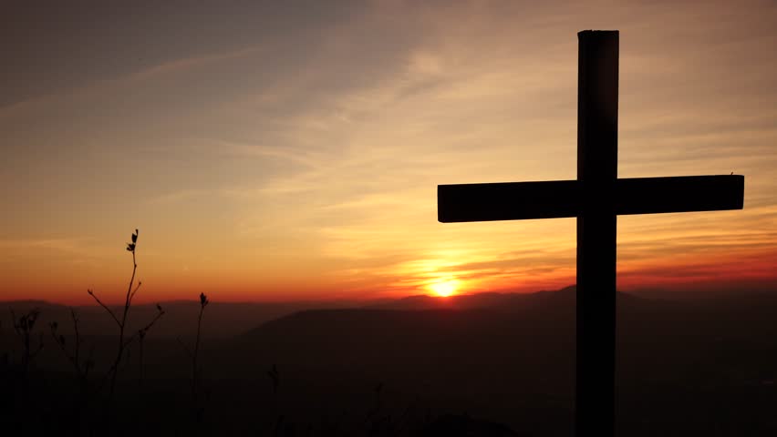 The Risen Christ: Time Lapse Sunrise Behind Calvary Cross Stock Footage ...