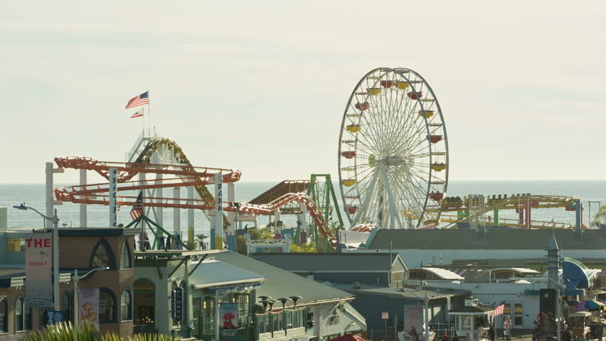 SANTA MONICA - JAN 15, 2015: Ferris Wheel Spinning, American Flag, And ...