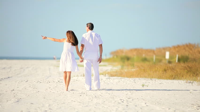 Attractive Healthy Couple Enjoying Quiet Time Together Walking On The ...